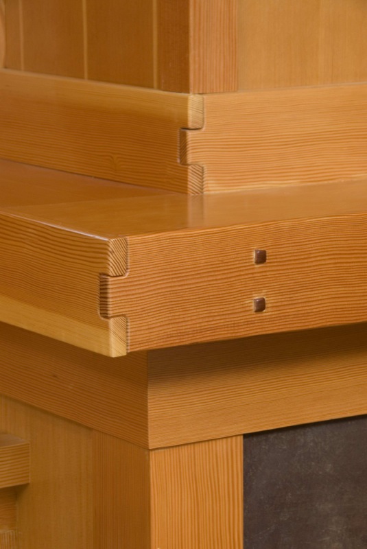 Greene and Greene-inspired joinery at fireplace mantle.