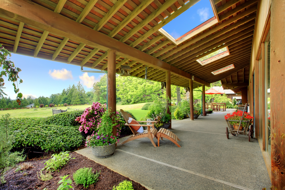 Large ranch covered porch with flowers